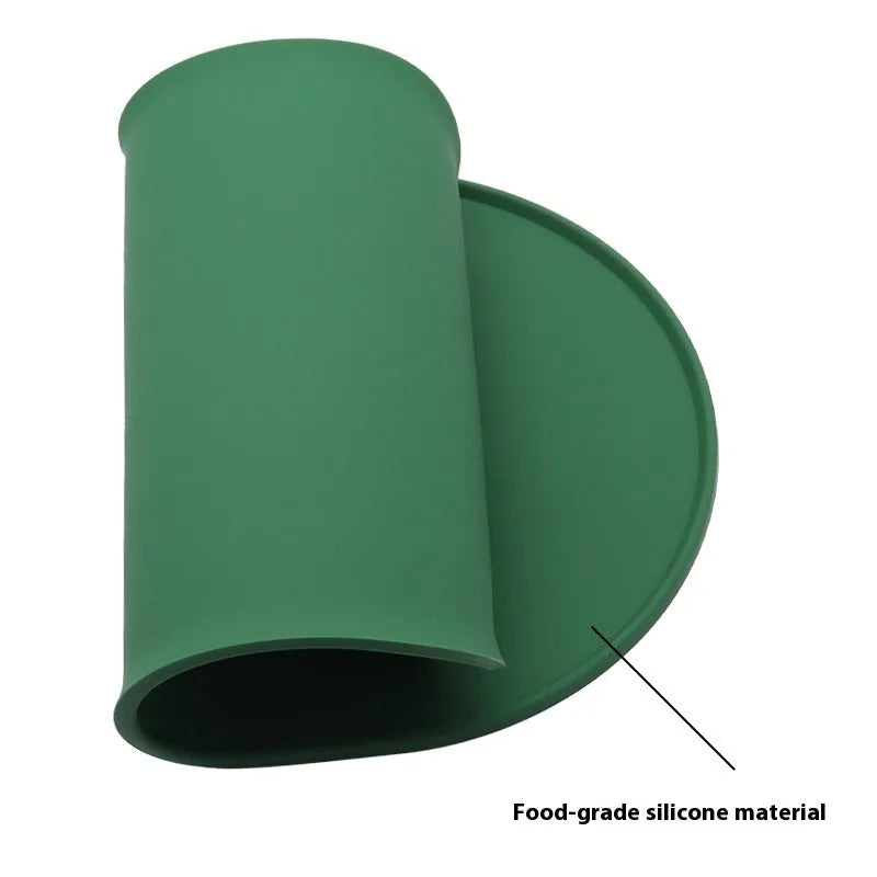 Green silicone waterproof cat feeding placemat with non-slip backing under a food bowl