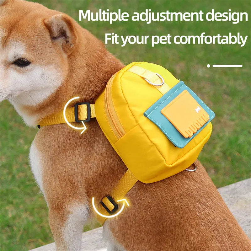 Blue adjustable dog backpack harness with storage compartment and a tow rope laid flat