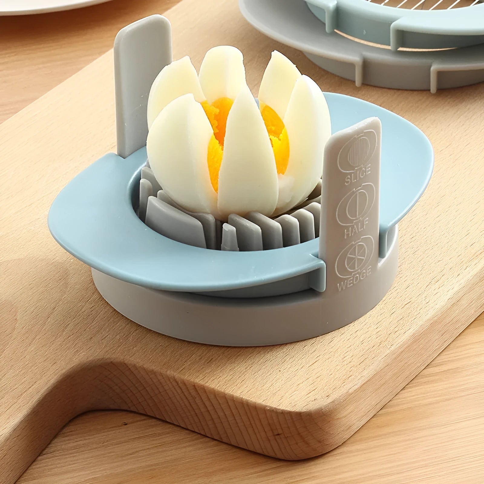 Manual egg cutter three-in-one with stackable parts, PS body, SS304 blades, available in blue, orange, red