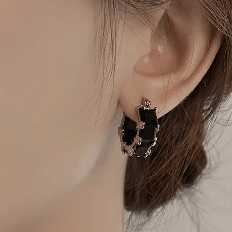 Gold-plated geometric U-shaped earrings with round black zircon crystal stones