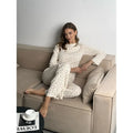Women's white floral print matching set with bell sleeve top and wide leg trousers