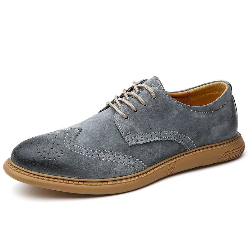 Men's black leather low-top lace-up business shoes with a rubber sole on a plain background.
