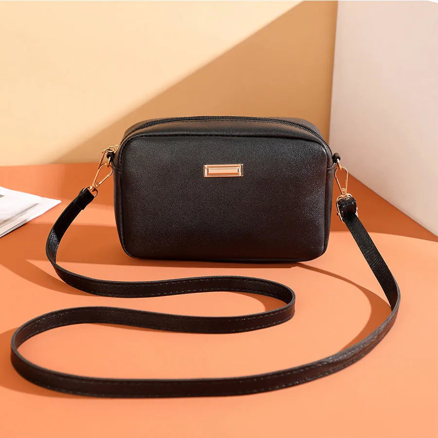 Solid colour women's PU shoulder bag with three-dimensional pocket design in urban simple style