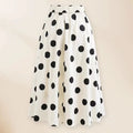 Women's black one-piece swimsuit with a white bow and attached round skirt.