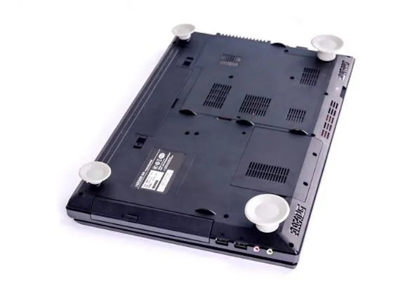 Grey laptop cooling pad set with large and small durable plastic pads for notebook temperature reduction