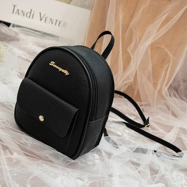 Women's small black PU backpack purse with letter design and zipper closure