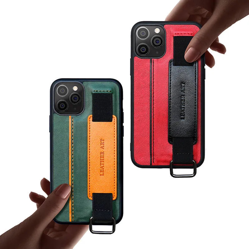 Brown imitation leather wallet-style iPhone case with a detachable wrist strap, shown attached to an iPhone 12.