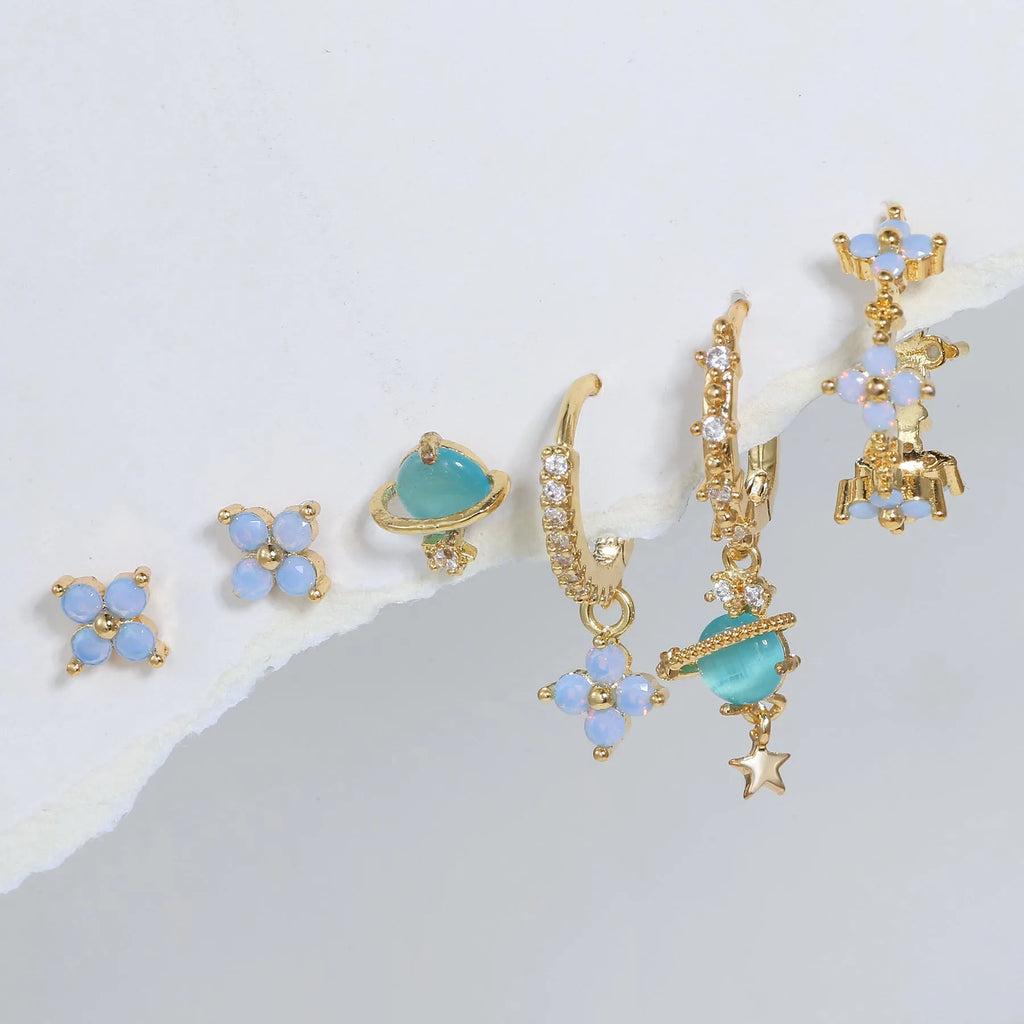Flower-shaped stud earrings with zircon crystal centres in gold and silver colour options