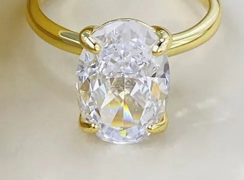 Oval gemstone ring for women with four-claw setting in gold or silver plating