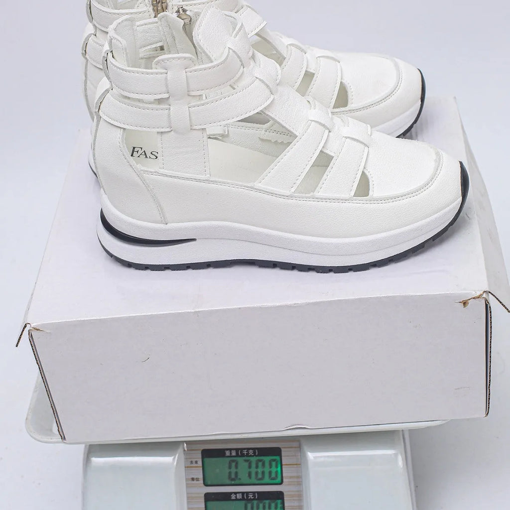 Women's black close-toed hollow-out platform sandals with Velcro fastening showing round toe design