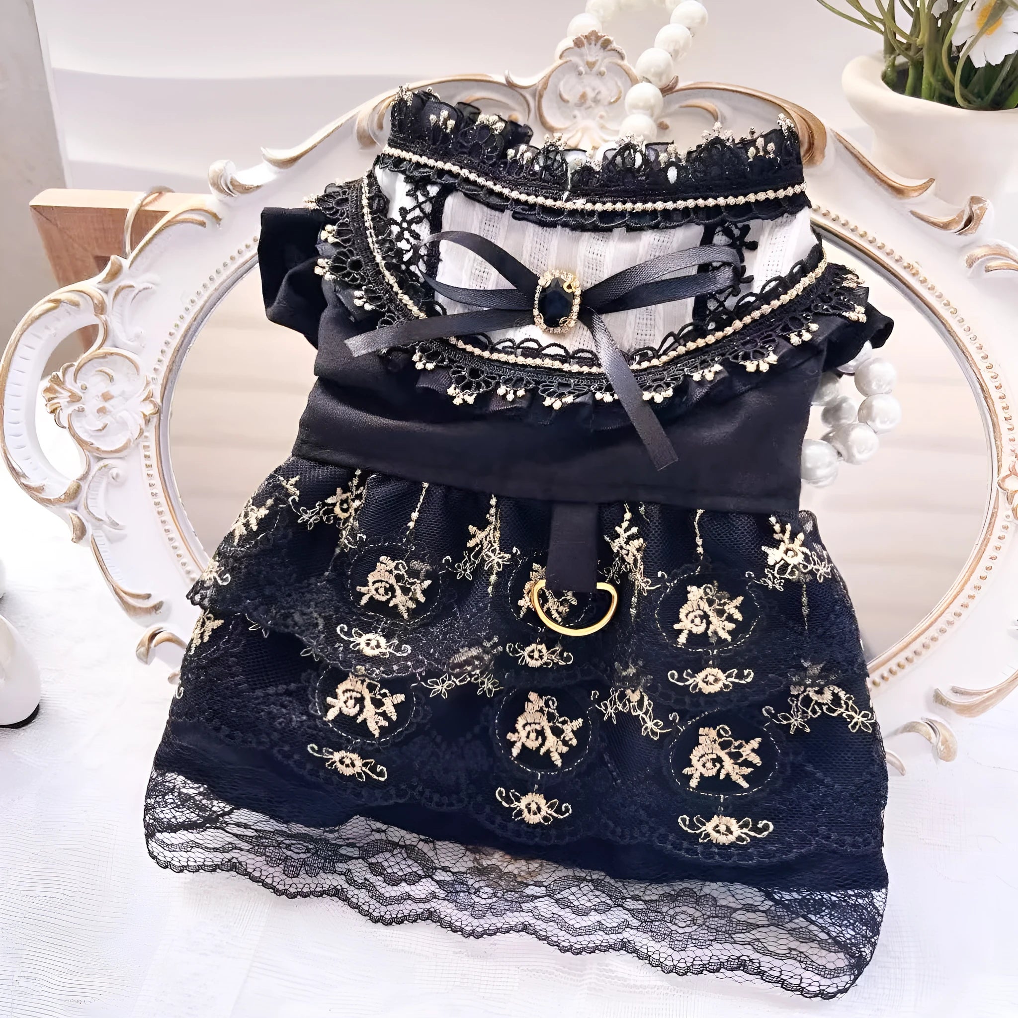 Golden polyester gothic princess style dress for a small dog on a mannequin.