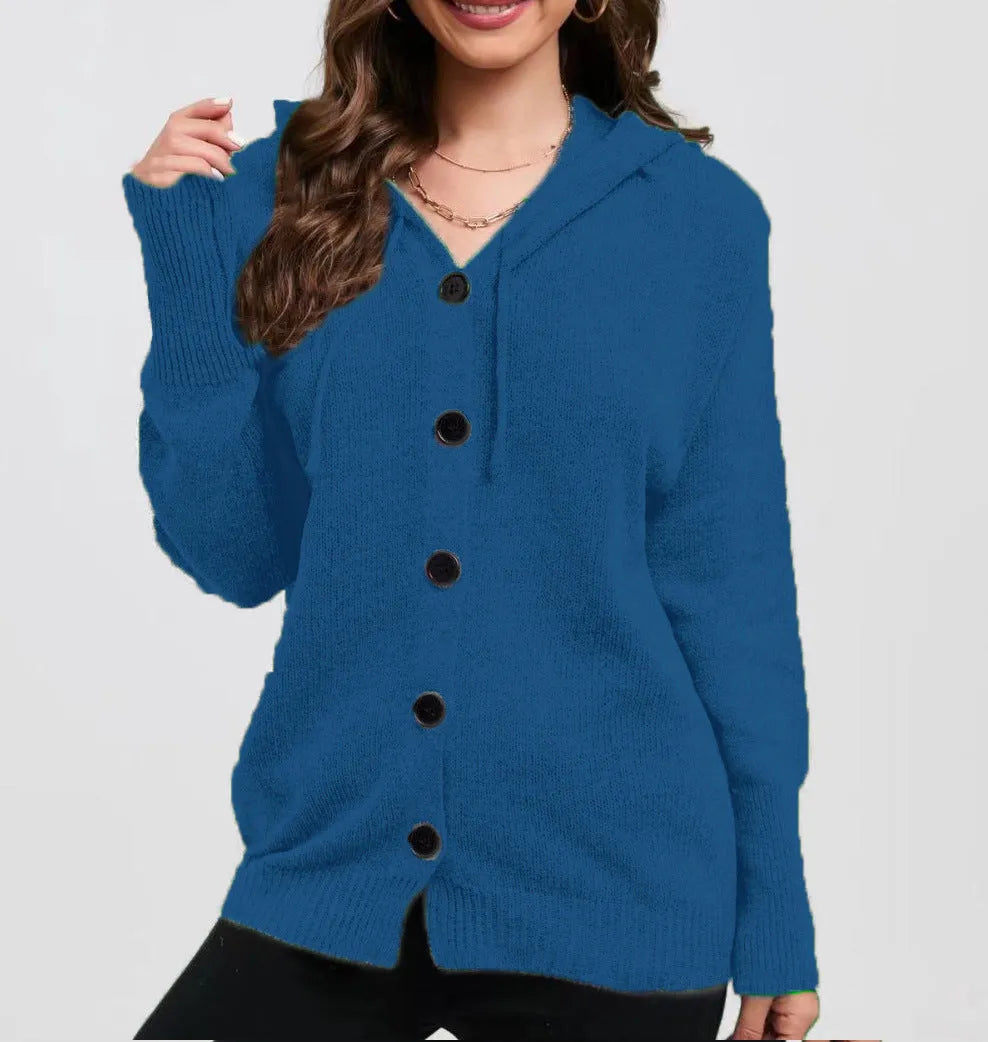 Woman wearing a loose fit, hooded, caramel-coloured cotton cardigan sweater with a textured pattern.