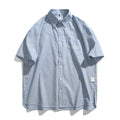 Blue striped short-sleeved overall shirt with cardigan opening and cotton blend fabric
