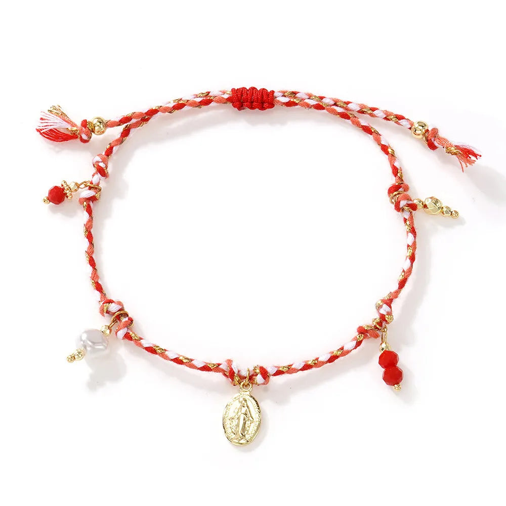 Close-up of a colourful hand-woven braided rope bracelet for women in ethnic style.