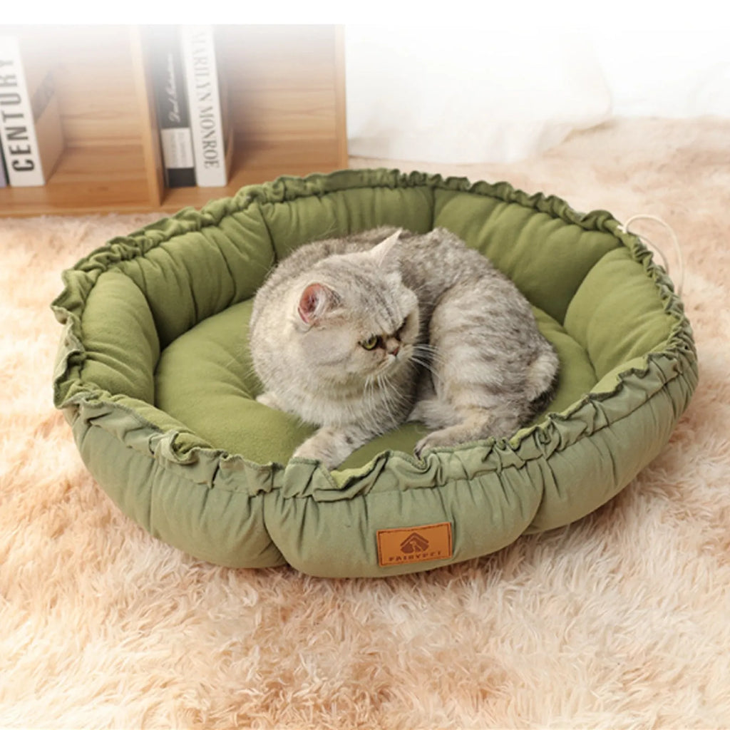 Grey and green reversible donut-shaped cat bed for indoor pets, shown in small, medium, and large sizes.