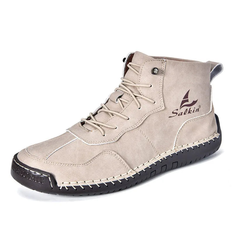 Casual high-top leather boots with elastic band closure and flat heel in beige colour with visible sewing detailing