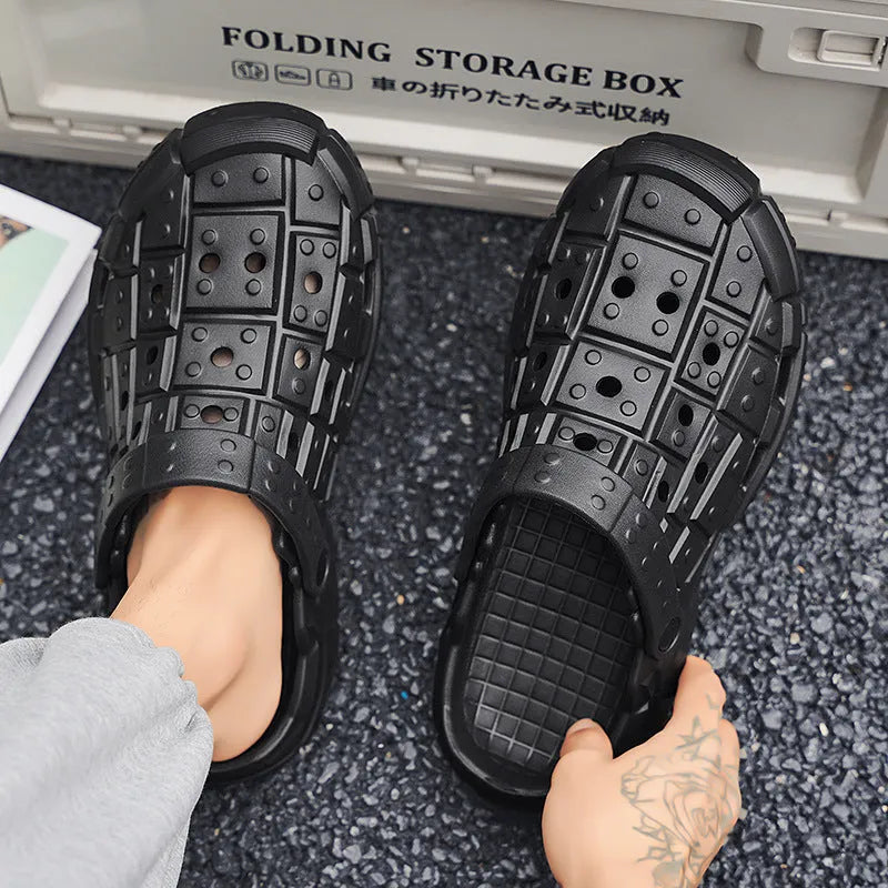 Men's black EVA slippers with thick sole, non-slip tread, and toe separator design on a white background.