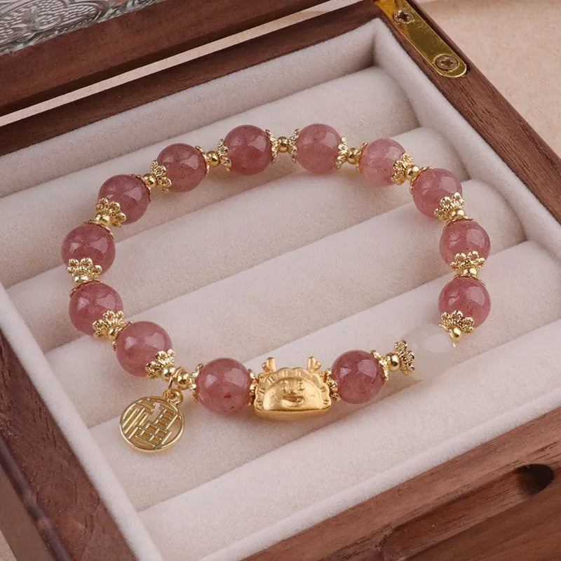Women's floral glazed bracelet with ice crack texture and zodiac animal charm on wrist.