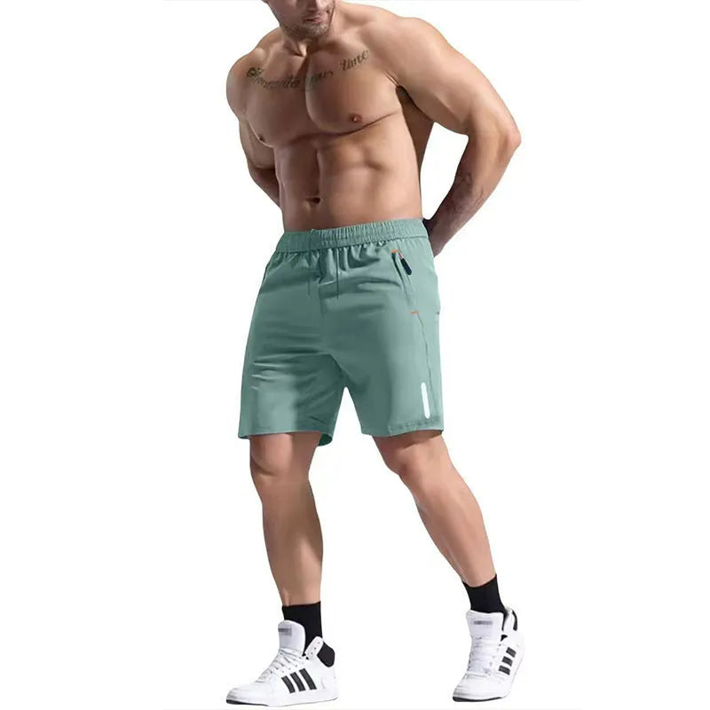 Men's bamboo fibre sports shorts in army green with an elastic high waist and drawstring closure.