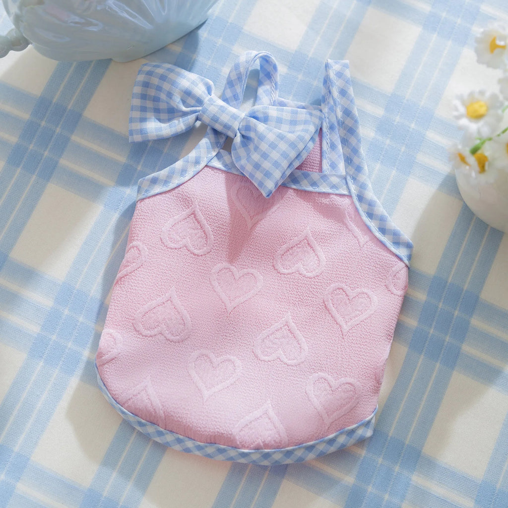 Small dog wearing heart relief texture bow suspenders vest in Bondi Blue colour with matching hairband