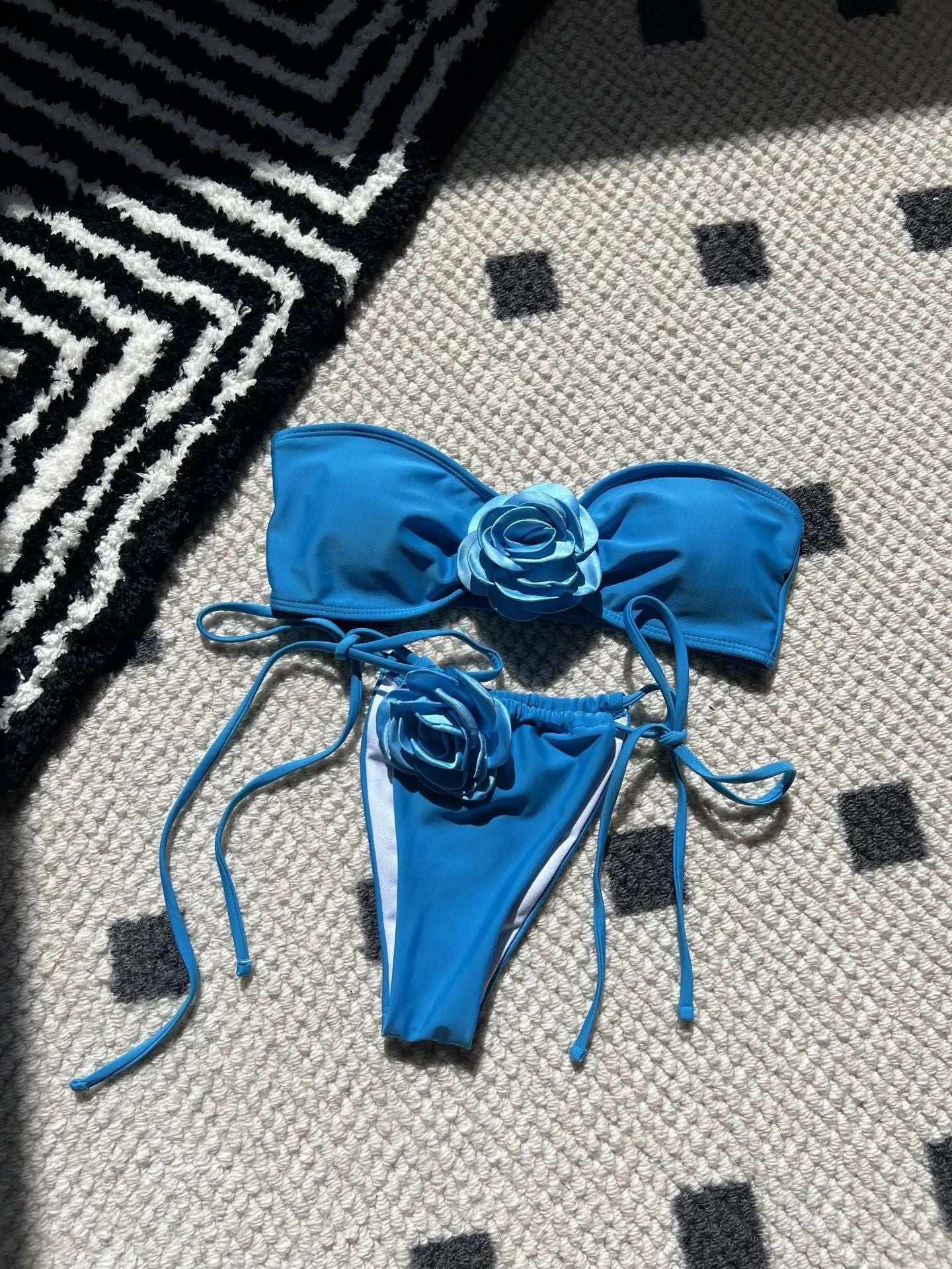 Women's solid colour drawstring tube top and bikini brief swimsuit set on a mannequin.