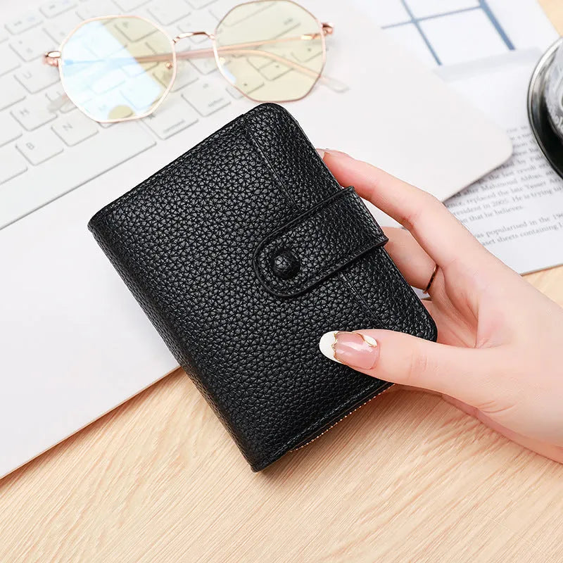 Ladies' short PU leather wallet with lychee pattern, shown in bifold open view.