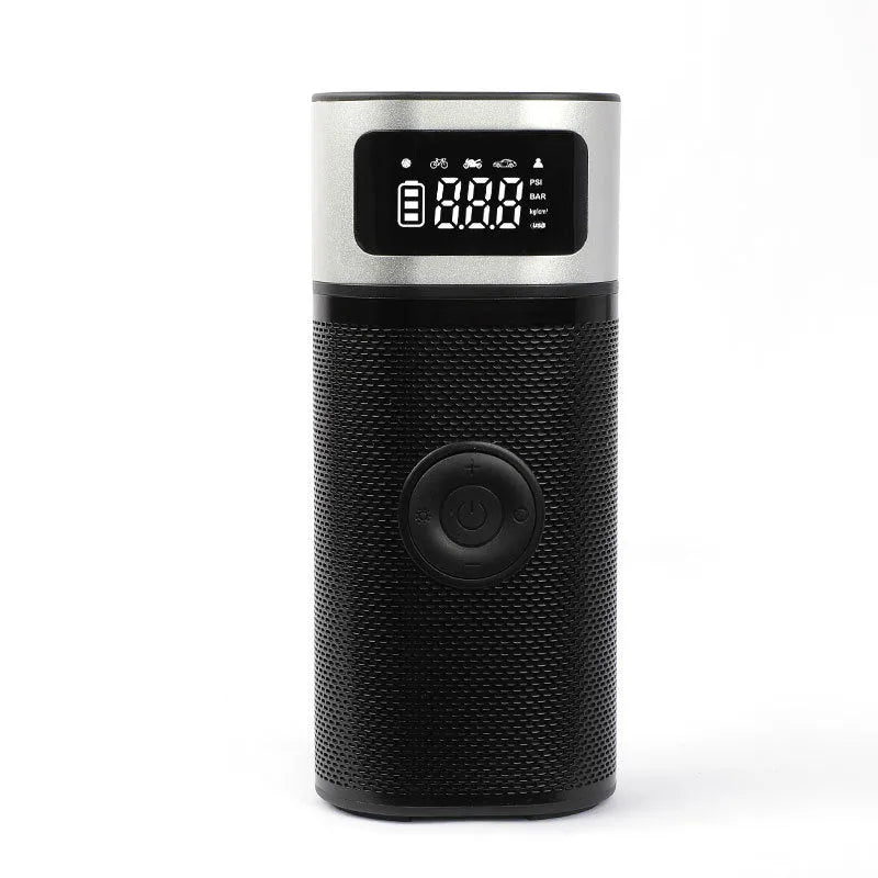 Black portable wireless air pump with USB charging cable, inflation tube, and a set of nozzles on a grey background.