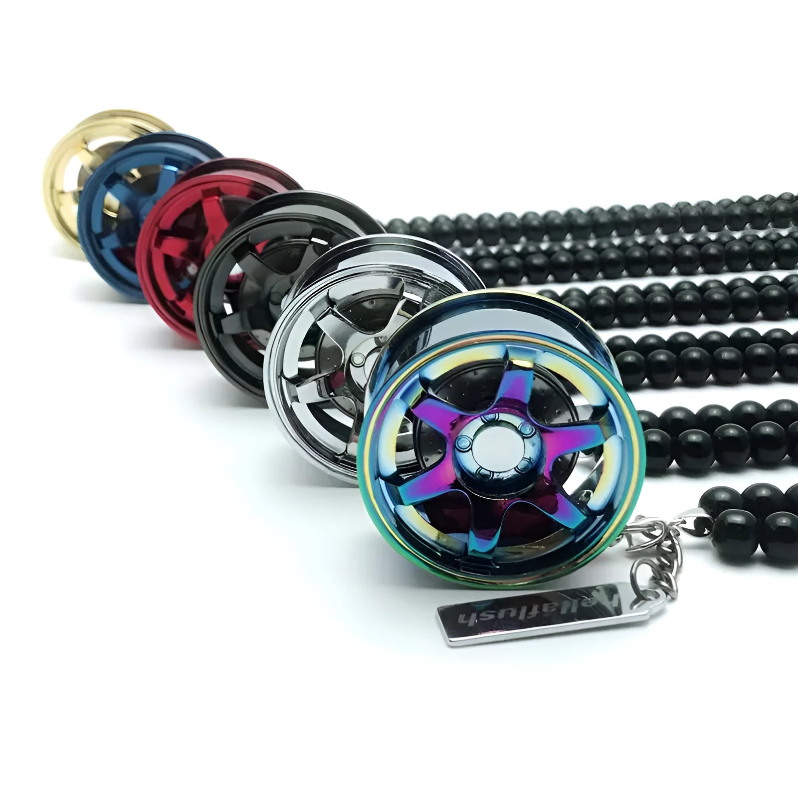 Stainless steel car tyre ornament with crystal glass bead chain hanging from a rearview mirror
