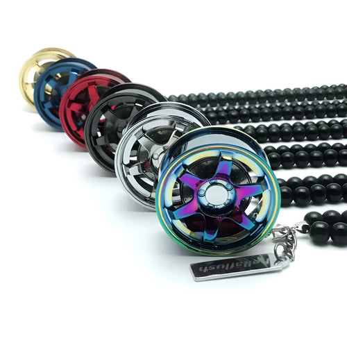 Stainless steel car tyre ornament with crystal glass bead chain hanging from a rearview mirror