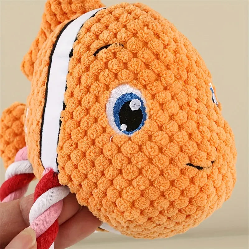 Grey turtle-shaped plush dog chew toy with textured knots on its shell.