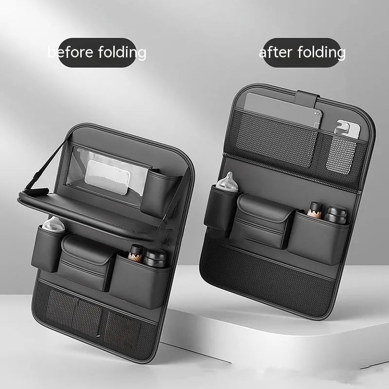 Car seat lazyback storage bag in Obsidian Black with foldable dining table extended, hanging on a car front seat backrest