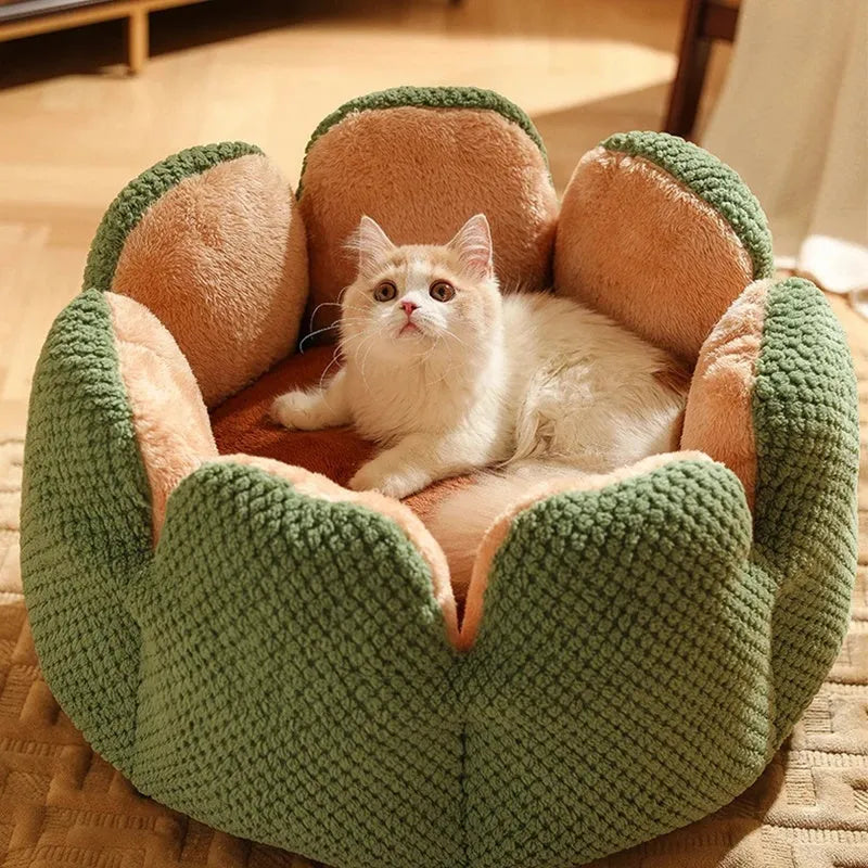 Green cactus petal shaped enclosed soft plush bed for a cat or small dog on a hardwood floor.