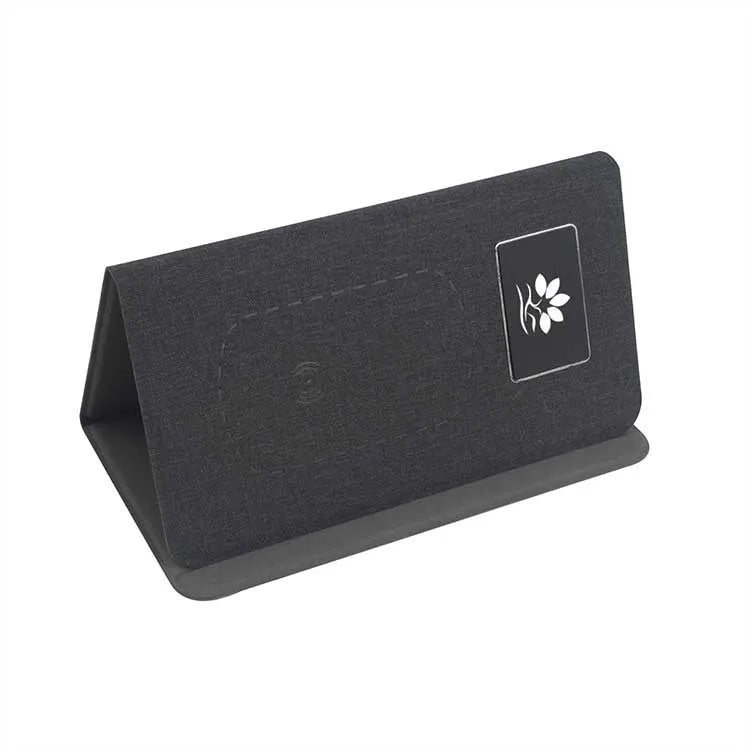 Folding wireless charging mouse pad set with cloth surface, compact mouse, and handbag.