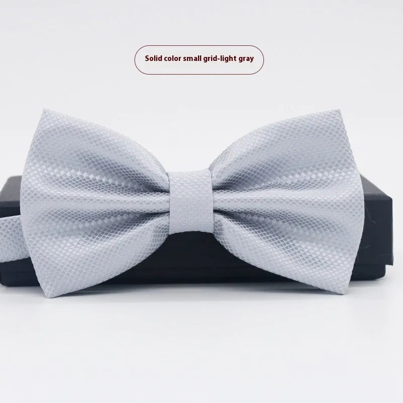 Solid colour polyester bow tie with flat head design measuring 12cm by 6cm