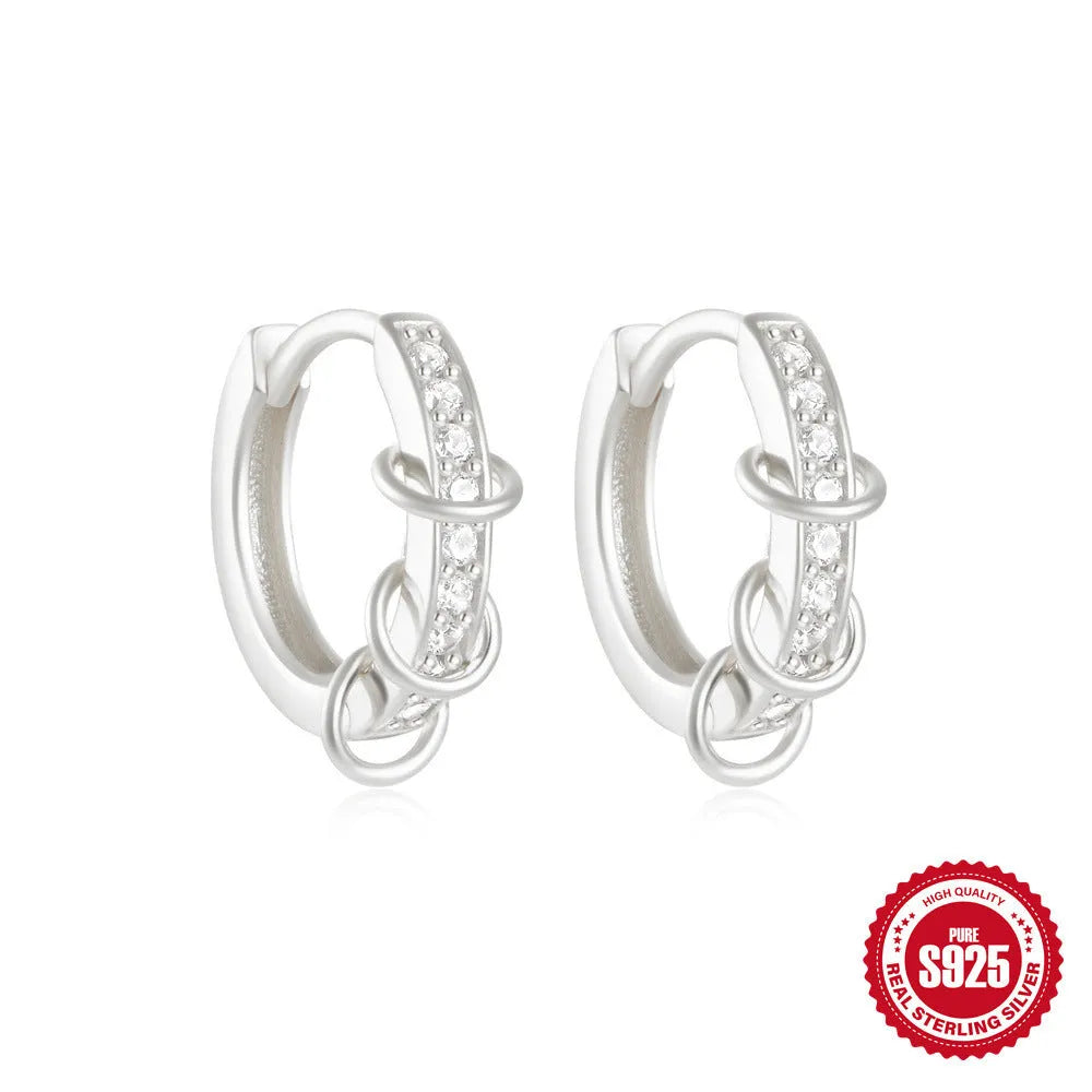 Small round geometric sterling silver stud earrings in gold and silver electroplated finishes.