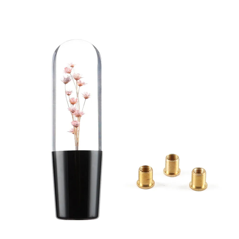 Transparent crystal car gear shift knob in assorted colours with three metal adapters.