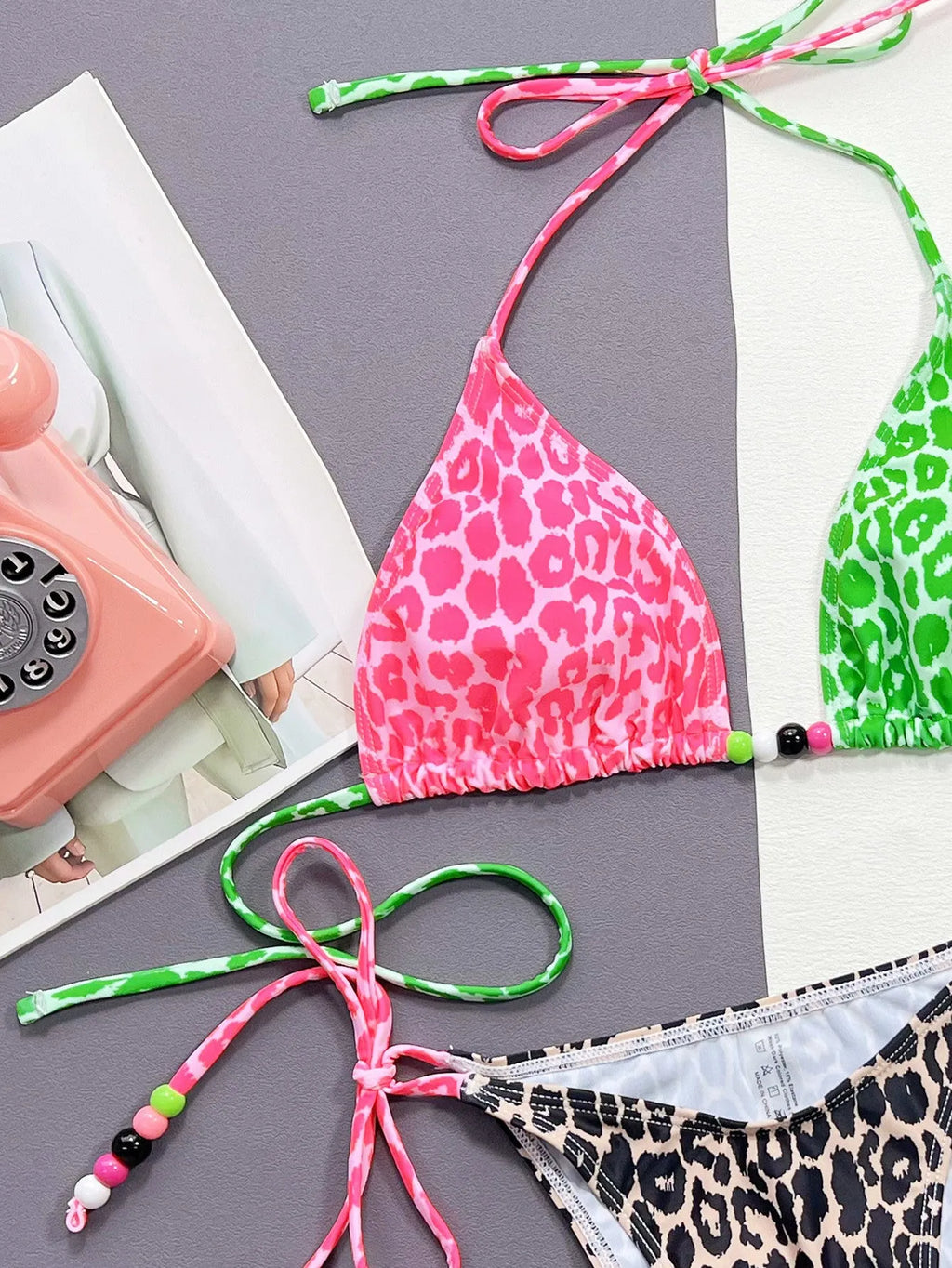 Women's leopard print bikini swimsuit with bra and briefs on white background