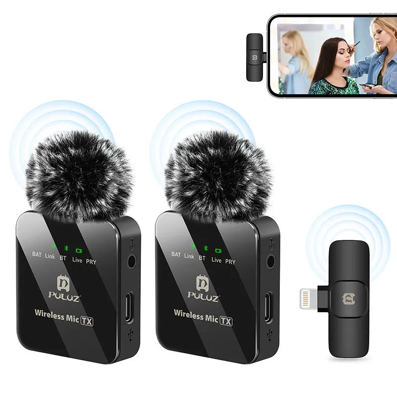 Wireless carbon fibre neckline clip microphone transmitter on a black background with storage box and accessories