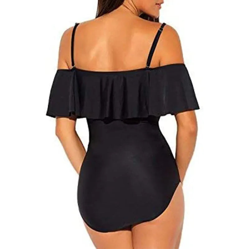 Black one-piece swimsuit with cut-out side detailing and ruffled straps