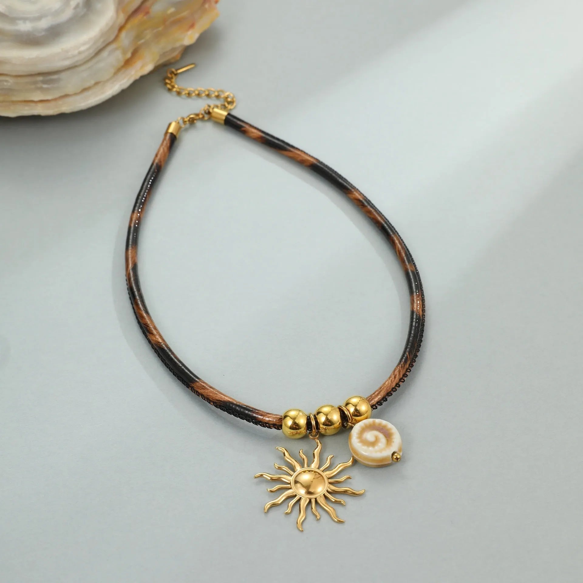 Geometric leopard pendant necklace for women in gold-plated stainless steel on an adjustable chain.