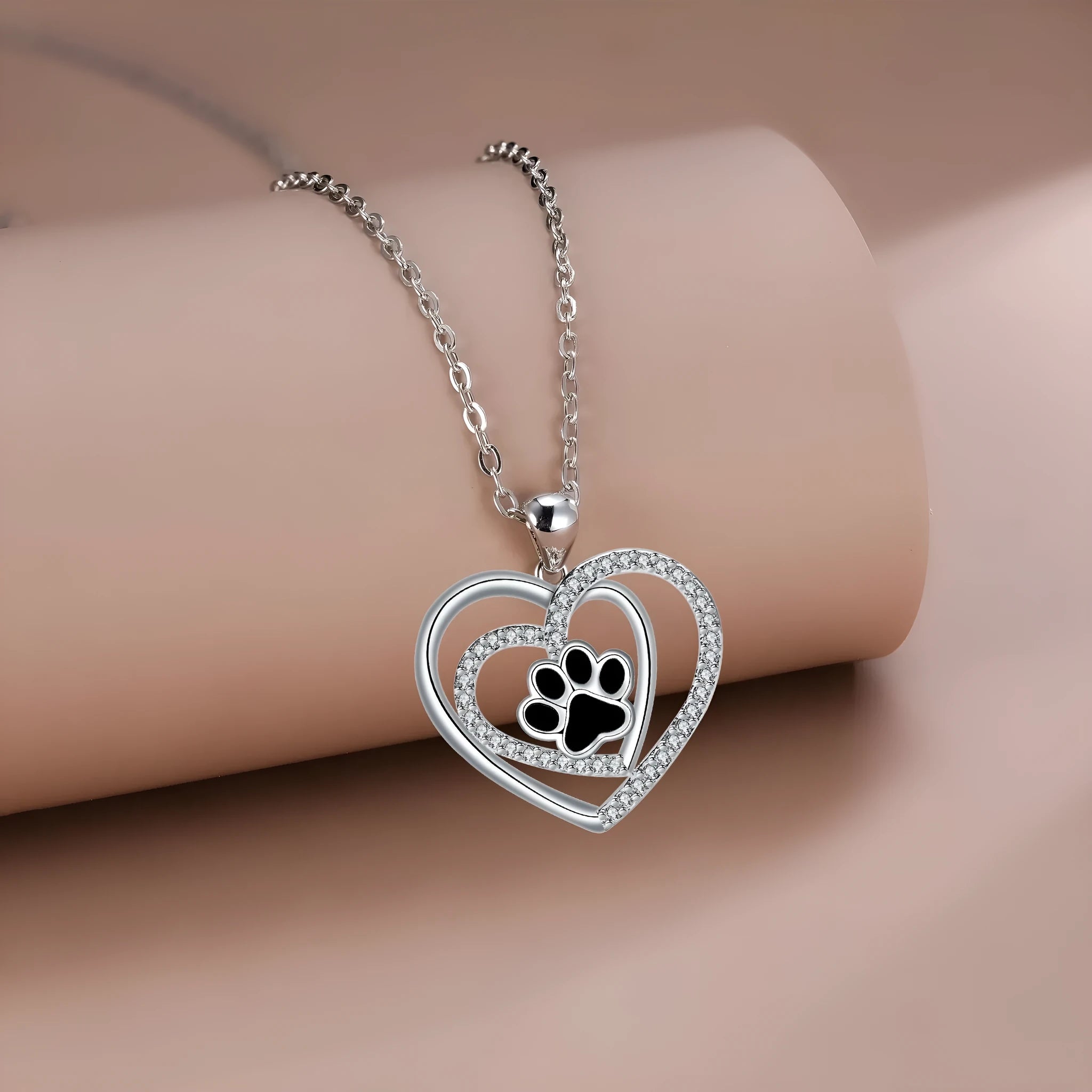 Copper dog paw print necklace with heart motif on cross chain for women