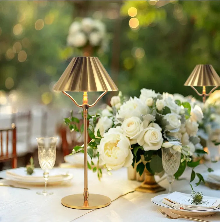 Gold-coloured alloy rechargeable LED desk lamp with a touch switch on its base.