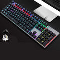 AOC GK410 wired mechanical keyboard with backlit keys on a desktop, showing full 104-key layout.