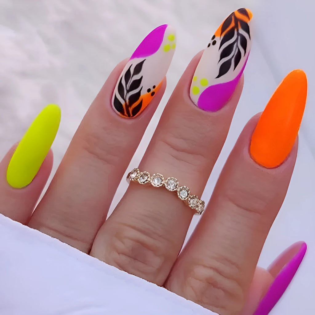 Wear Armour medium almond nail stickers in frosted French leaves, macaron, leopard print, and plating designs.