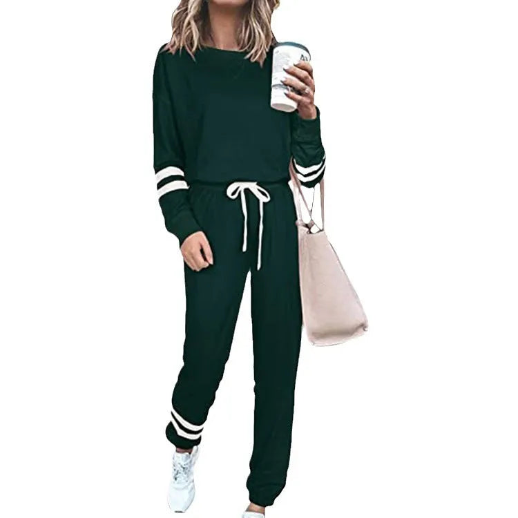 Women's plus size casual two-piece suit set in a solid colour, showing loose-fitting long sleeve top and trousers.