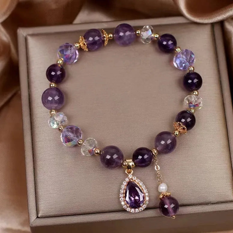 Close-up of a women's purple amethyst crystal bracelet with micro inlay detailing.