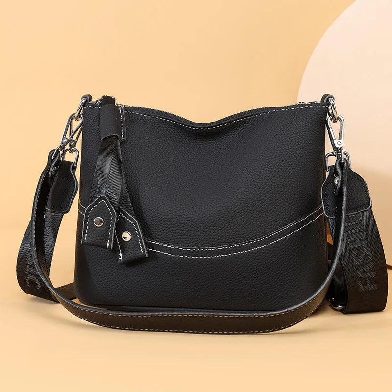 Genuine leather crossbody bag in black with spliced design and multiple internal pockets