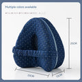 Love heart-shaped dark blue memory foam leg pillow for adult knee and leg support.