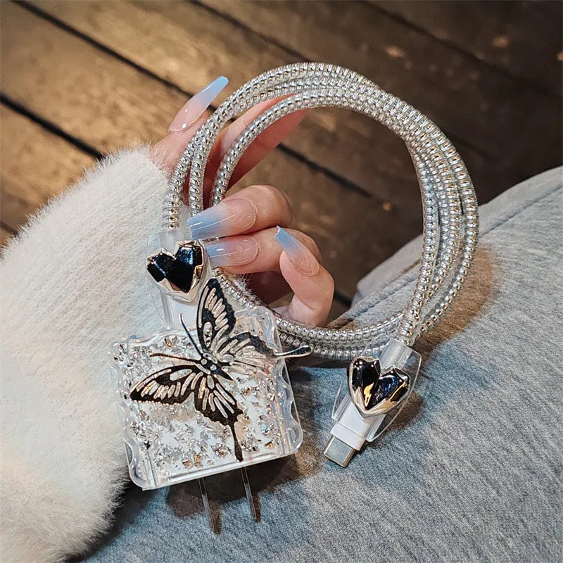 Three-dimensional butterfly USB cable protection sleeve in silver foil for data cable organisation