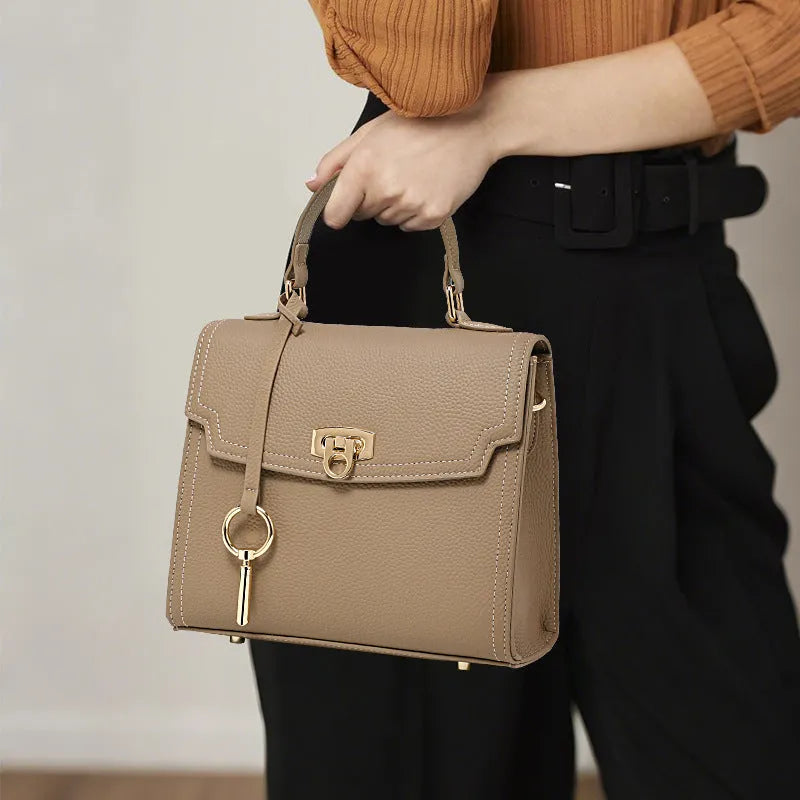 Elephant grey genuine leather vintage lock handbag with crossbody strap and square vertical shape